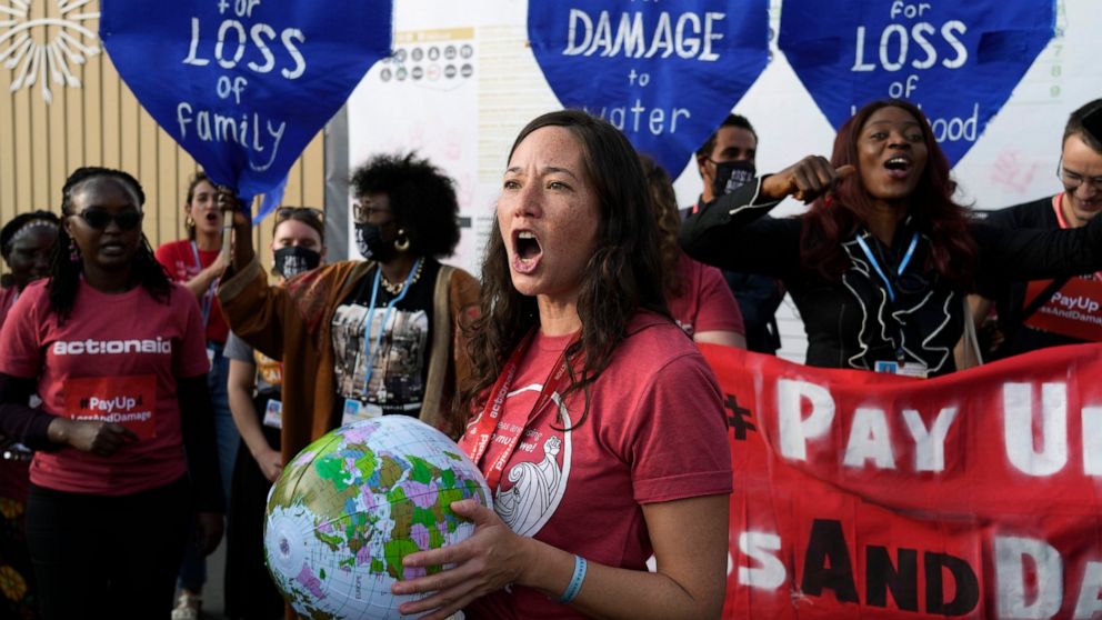 Activist Teresa Anderson participates in a protest demanding pay for loss and damage at the COP27 U.N. Climate Summit, Wednesday, Nov. 16, 2022, in Sharm el-Sheikh, Egypt. (AP Photo/Peter Dejong)