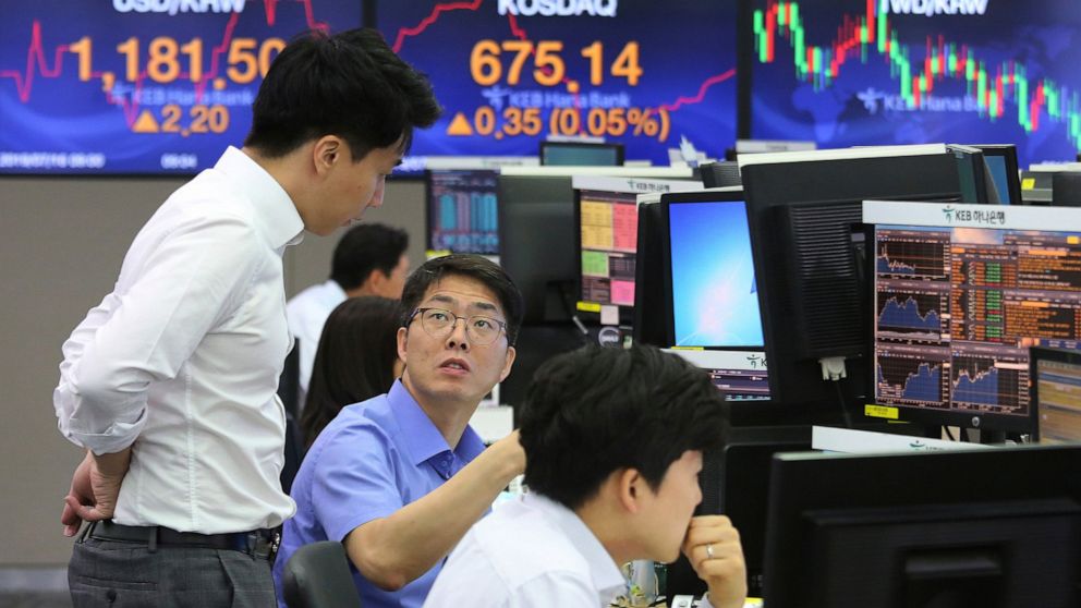 Currency traders work at the foreign exchange dealing room of the KEB Hana Bank headquarters in Seoul, South Korea, Tuesday, July 16, 2019. Asian shares were little changed and mixed in quiet trading Tuesday amid a lack of fresh market-moving news as