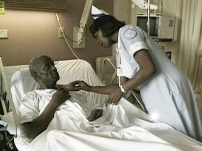 VIDEO: Nurse tends to a patient.