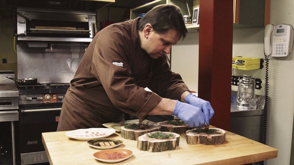 PHOTO: Damon Baehrel prepares dishes in his basement restaurant in Earlton, New York, Oct. 27, 2015.