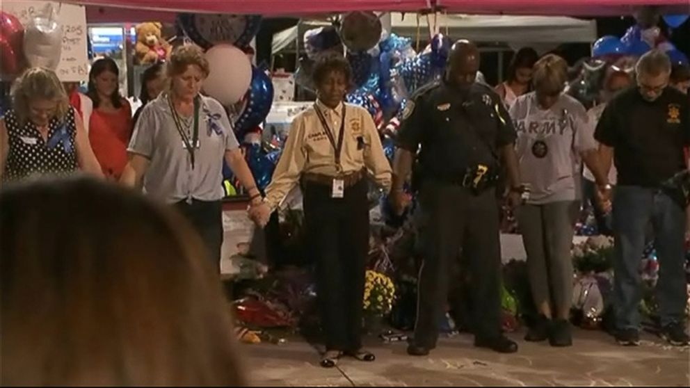 PHOTO: People can be seen gathering around Deputy Goforth's shrine at the Chevron gas station where he was fatally shot in this screen grab on Sept. 6, 2015.