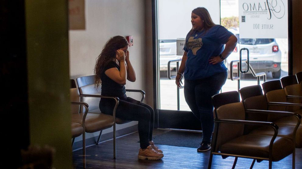 PHOTO: A patient is brought to tears as a staff member informs her  that the clinic can no longer provide services at Alamo Womens Reproductive Service in San Antonio, Texas, June 24, 2022. 