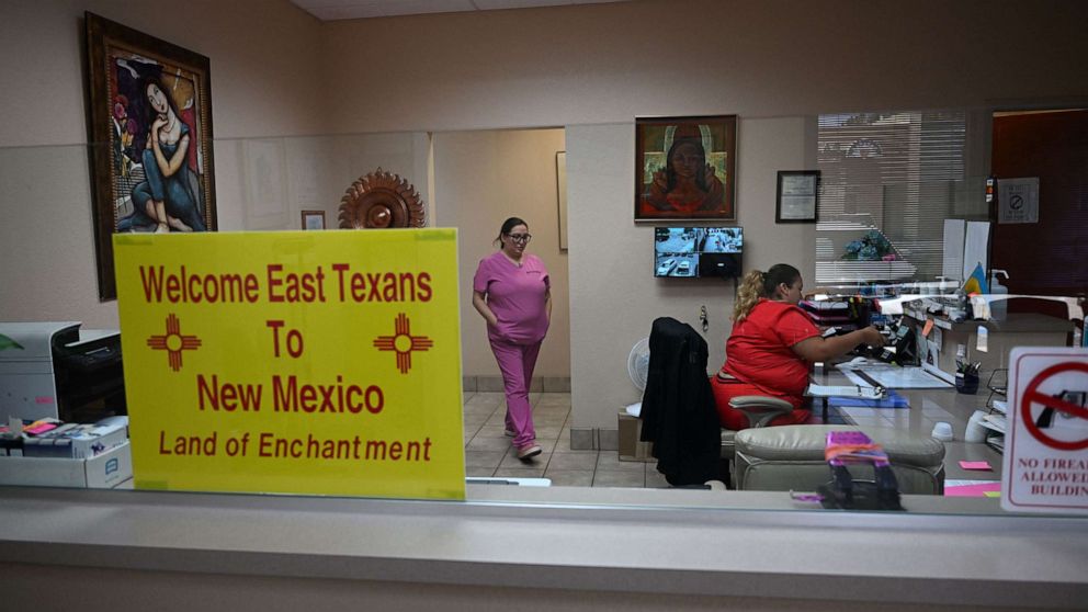 PHOTO: A sign welcoming patients from East Texas to New Mexico is displayed in the waiting area of the Women's Reproductive Clinic, which provides legal medication abortion services, in Santa Teresa, N.M., June 15, 2022. 