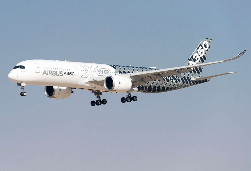 PHOTO: An Airbus A350 XWB aircraft, manufactured by Airbus SAS, performs an aerial display during the Dubai Airshow on Nov. 9, 2015, in Dubai.