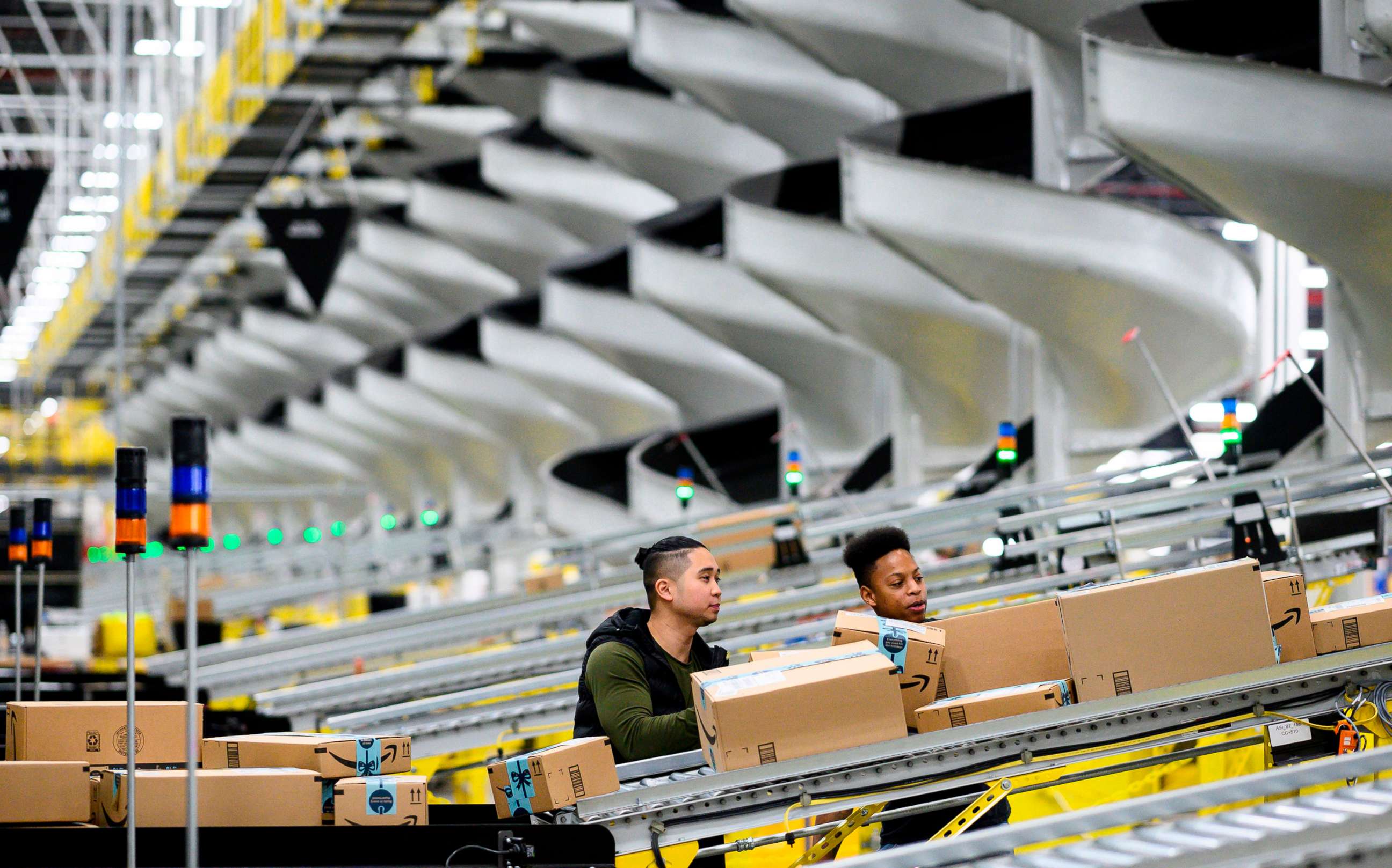 PHOTO: Men work in an Amazon fulfillment center in New York, Feb. 5, 2019.  