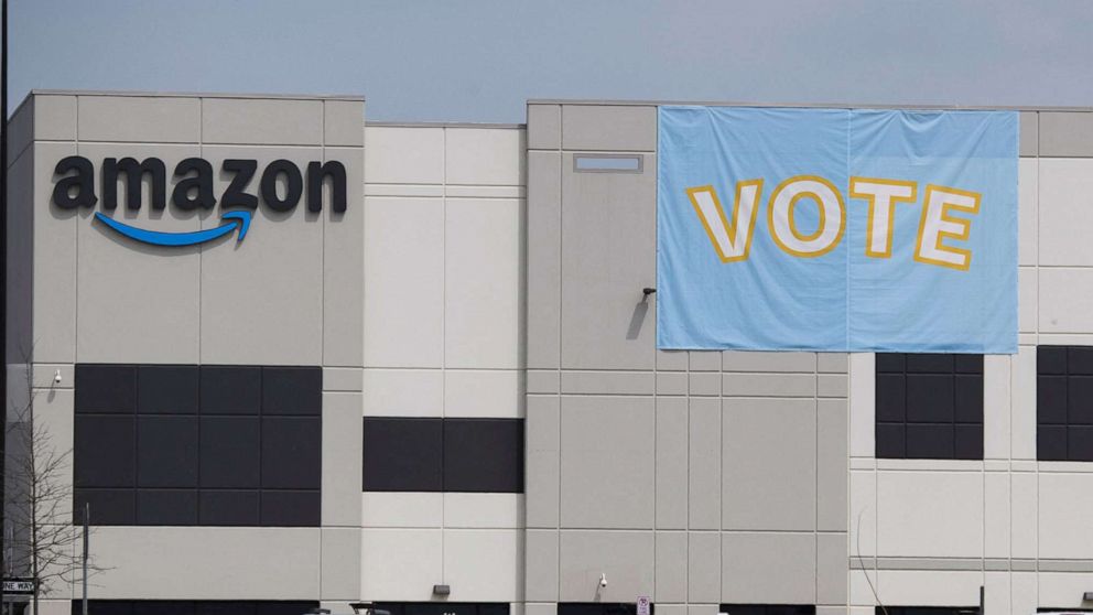 PHOTO: Vote signage hangs outside the Amazon.com, Inc. fulfillment center in Bessemer, Ala., March 26, 2021. 