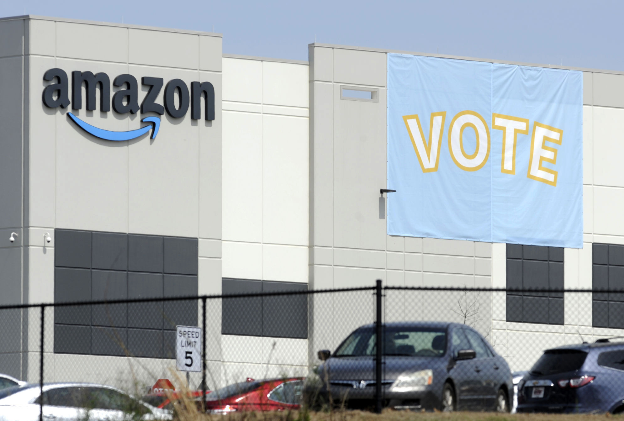 PHOTO: A banner encouraging workers to vote in labor balloting is shown at an Amazon warehouse in Bessemer, Ala., March 30, 2021.