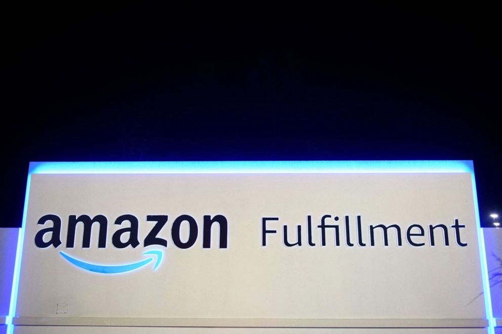 PHOTO: In this file photo taken on March 29, 2021, a sign at the Amazon.com, Inc. BHM1 fulfillment center is seen before sunrise in Bessemer, Ala.