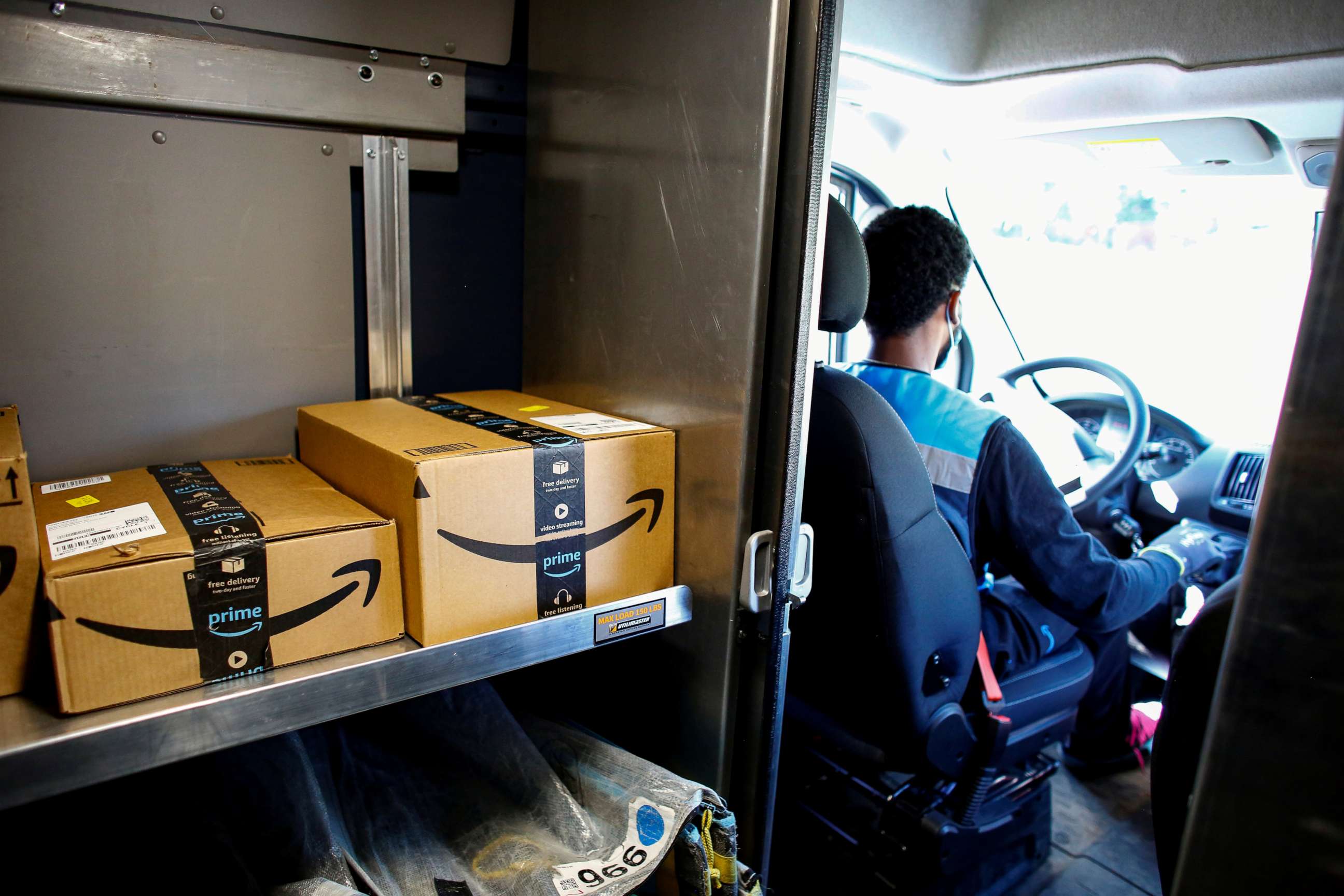 PHOTO: An Amazon worker delivers packages amid the coronavirus disease (COVID-19) outbreak in Denver, Colorado, April 22, 2020.