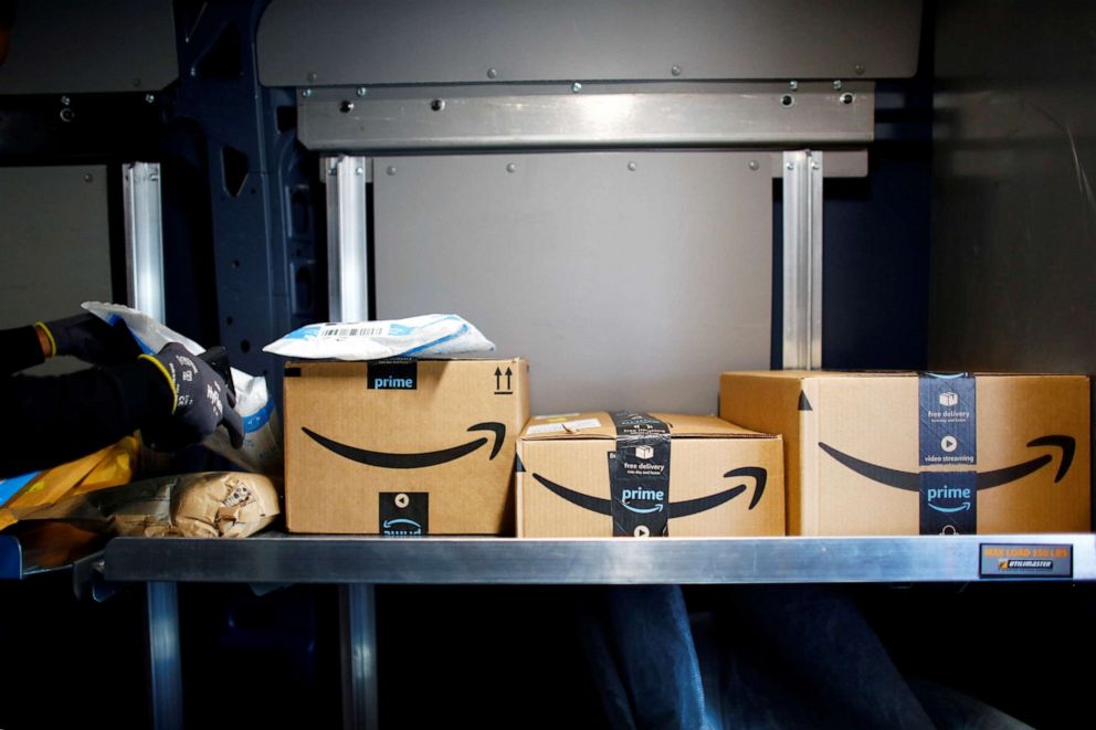 PHOTO: An Amazon worker delivers packages amid the coronavirus disease (COVID-19) outbreak in Denver, Colorado, April 22, 2020.