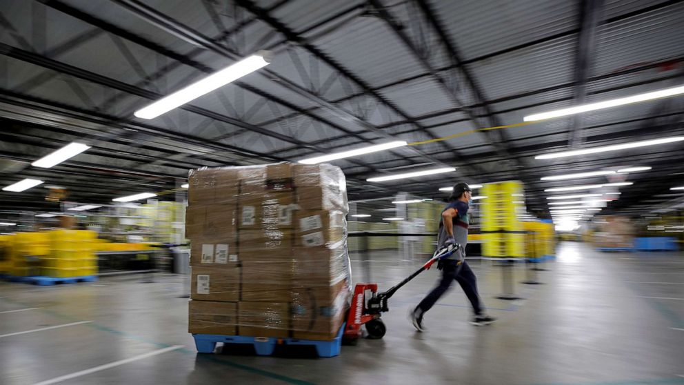 PHOTO: An employee pulls a cart full of items at Amazon's JFK8 distribution center on Staten Island in New York City on Nov. 25, 2020.