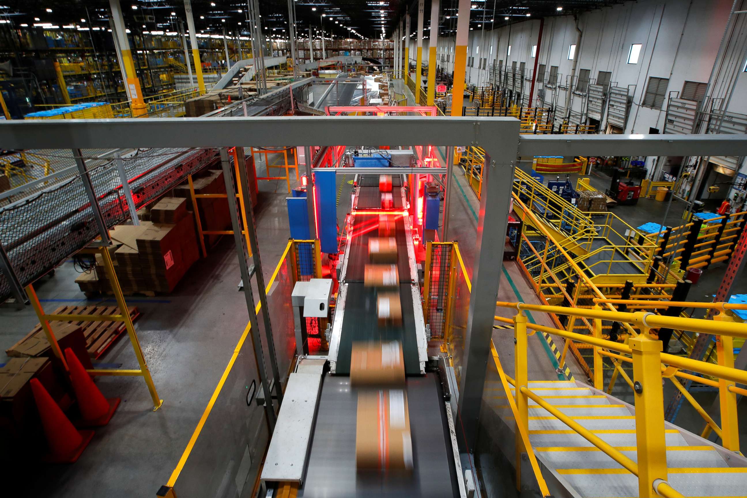 PHOTO: A fast-moving conveyor moves packages through a scanning machine on their way to delivery trucks during operations on Cyber Monday at Amazon's fulfillment center in Robbinsville, N.J., Nov. 29, 2021.
