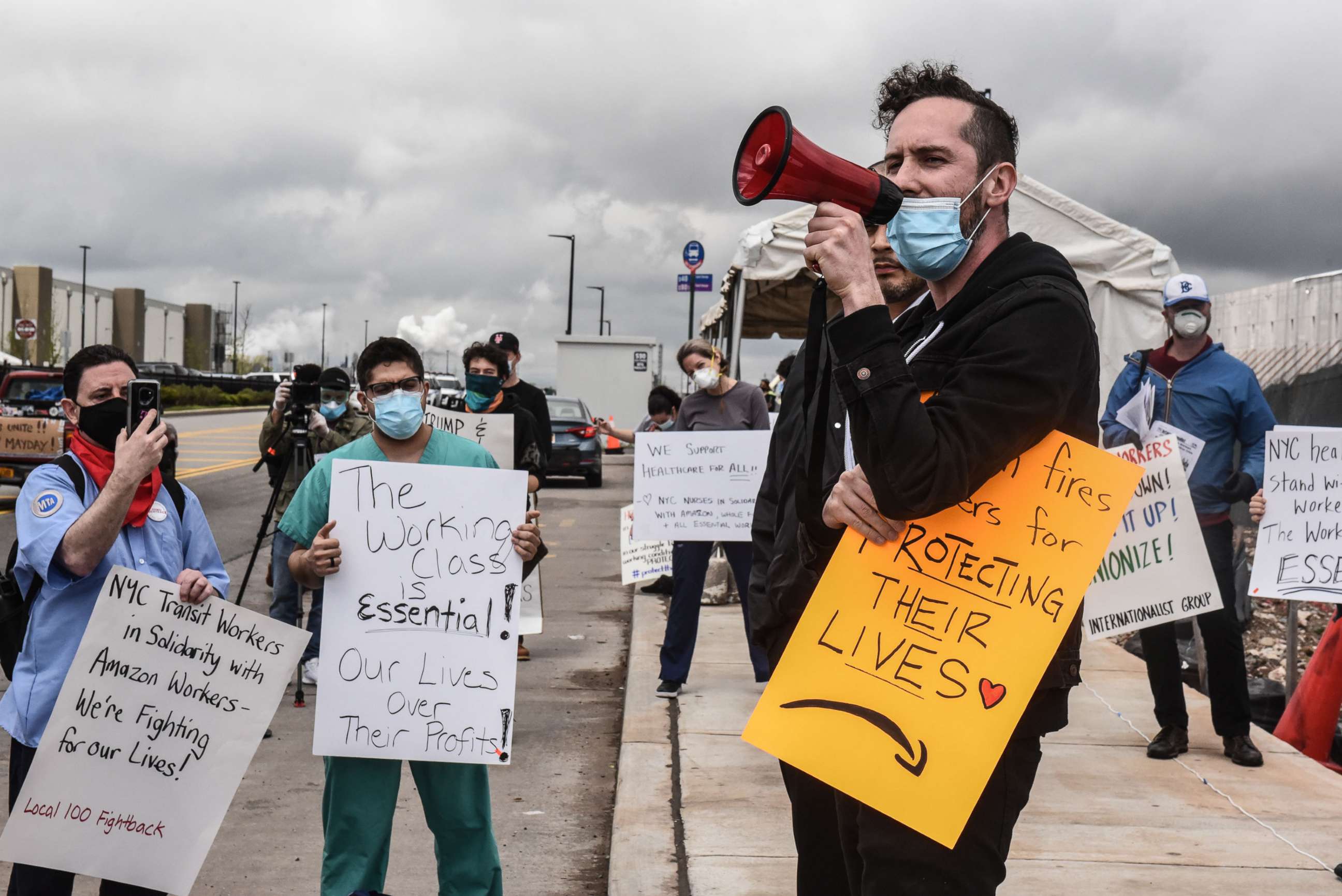 PHOTO: In this May 1, 2020, file photo, people protest working conditions outside of an Amazon warehouse fulfillment center in Staten Island, NY.