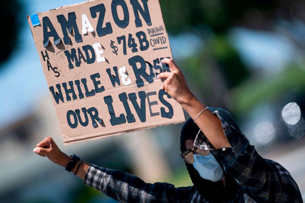 PHOTO: In this May 1, 2020, file photo, workers protest against the failure from their employers to provide adequate protections in the workplace of the Amazon delivery hub on National May Day Walkout/Sickout in Hawthorne, Calif.