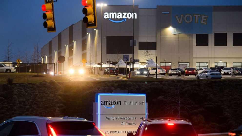 PHOTO: A Vote banner hangs at an Amazon fulfillment center on March 27, 2021 in Bessemer, Ala. Amazon Alabama workers are trying to unionize with the Retail, Wholesale and Department Store Union (RWDSU) in Birmingham.