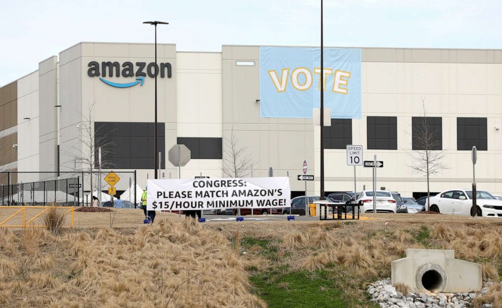 PHOTO: Banners hang at the Amazon facility before worker vote on whether to unionize, in Bessemer, Alabama, March 5, 2021.