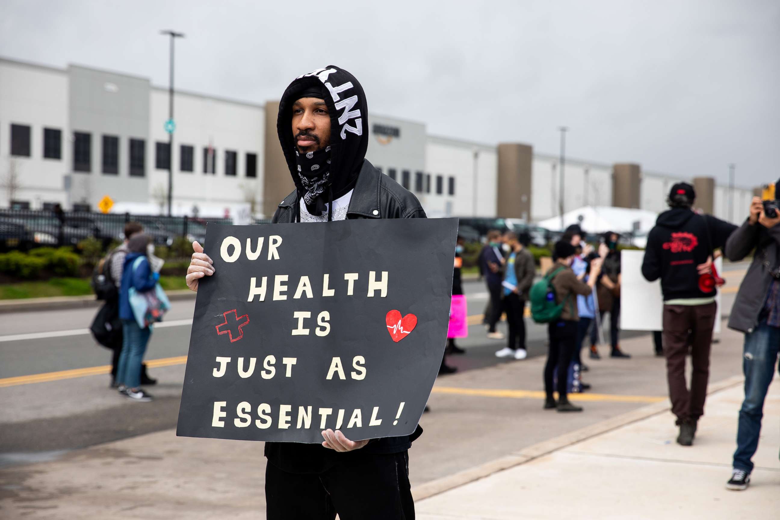 PHOTO: Chris Smalls speaks during a protest of working conditions outside of an Amazon warehouse fulfillment center in the Staten Island borough of New York, May 1, 2020. 