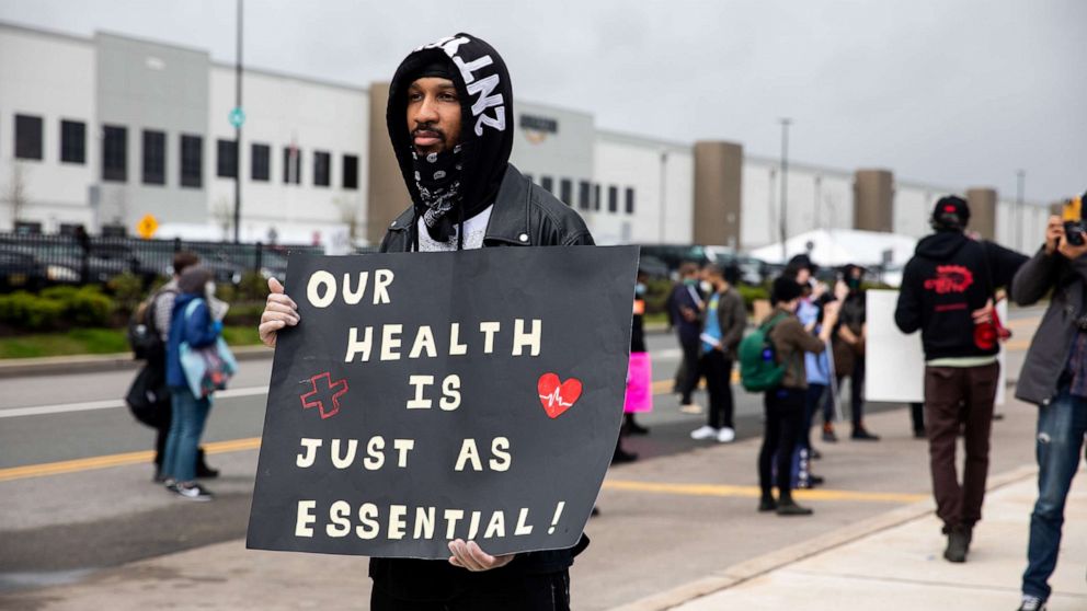 PHOTO: Chris Smalls speaks during a protest of working conditions outside of an Amazon warehouse fulfillment center in the Staten Island borough of New York, May 1, 2020. 