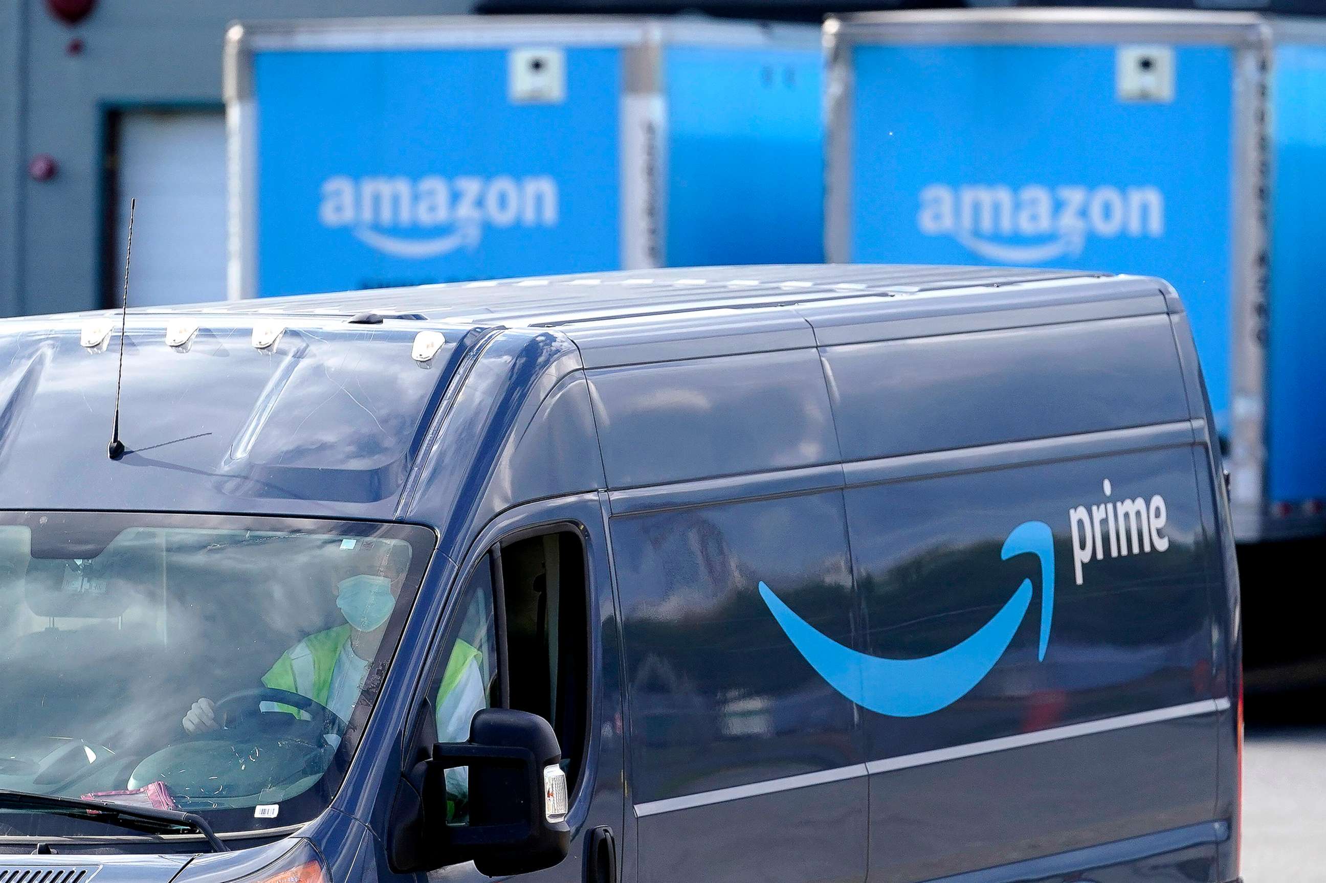 PHOTO: An Amazon Prime logo is seen on the side of a delivery van as it departs an Amazon Warehouse location on Oct. 1, 2020, in Dedham, Mass.