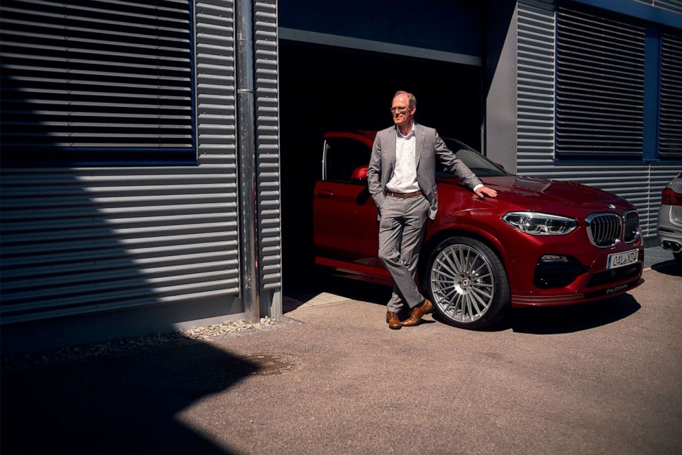 PHOTO: Andy Bovensiepen, who helps oversee his father's company, stands next to the BMW Alpina XD4.