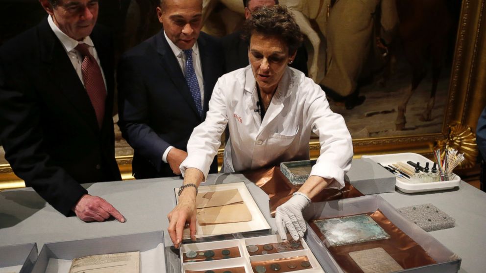 PHOTO: Museum of Fine Arts Boston Head of Objects Conservation Pam Hatchfield displays objects removed a time capsule