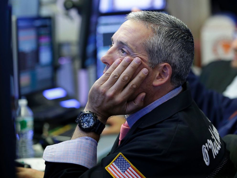 PHOTO: Traders work on the floor at the New York Stock Exchange in New York, July 8, 2015. 