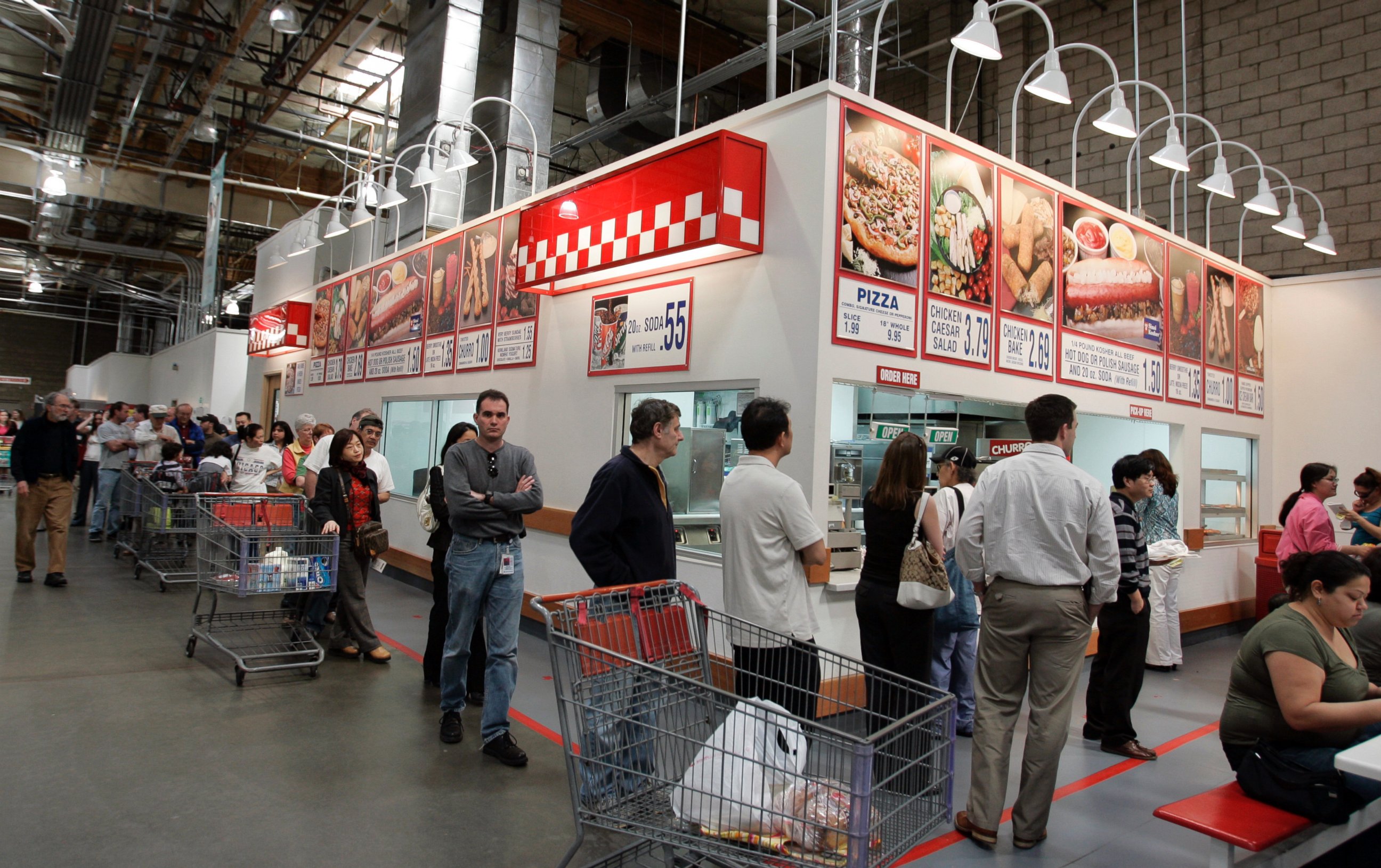 PHOTO: Costco warehouse customers wait in a long line during lunchtime for hot dogs, pizza, and drinks at a Costco store in Mountain View, Calif. on March 6, 2007.
