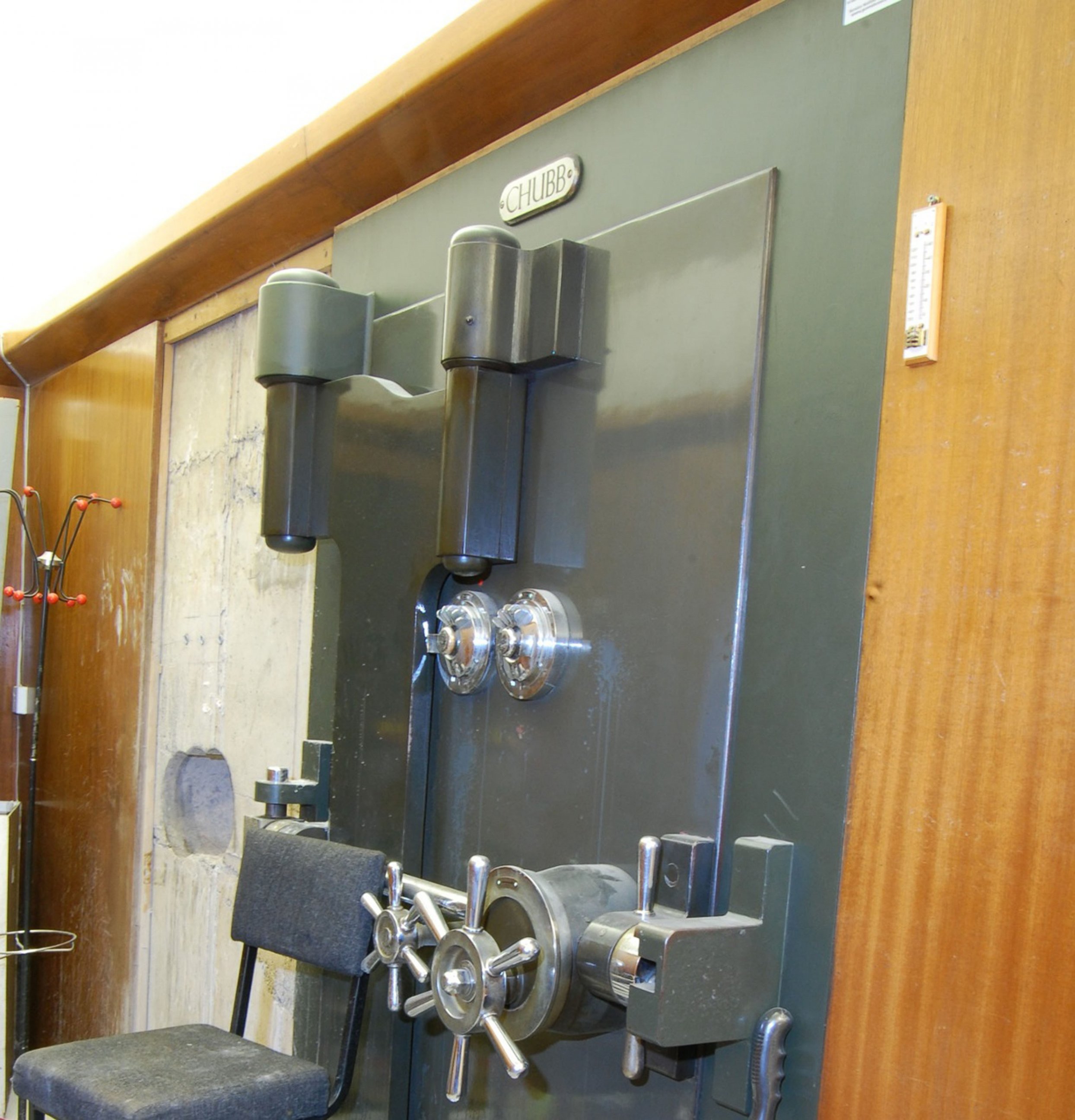 PHOTO: This is a an undated image made available on April 22, 2015 of the vault door  and a hole leading into the vault, left, at the Hatton Garden Safe Deposit company in London.