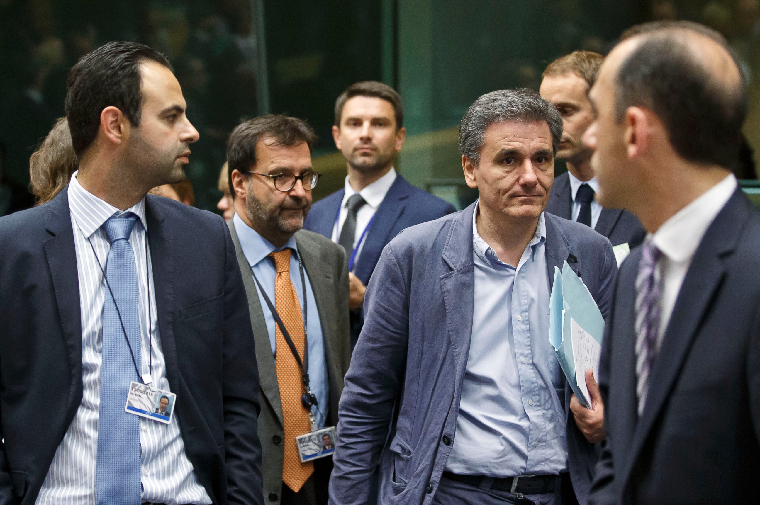 PHOTO: Greek Finance Minister Euclid Tsakalotos, third right, arrives for a round table meeting of eurozone finance ministers at the EU LEX building in Brussels on July 7, 2015.