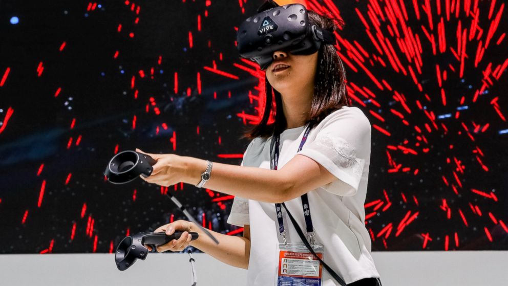 PHOTO: A visitor tries out an HTC VR device during the 2016 Mobile World Congress in Shanghai, China, June 29, 2016.