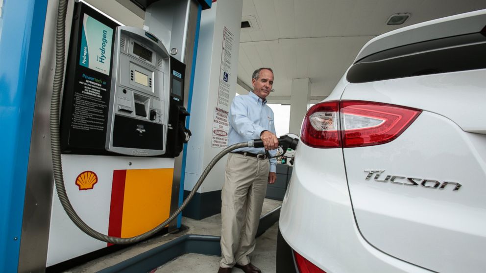 The Hyundai Tucson Fuel Cell Electric Vehicle gets topped off with hydrogen at a Shell Station on June 10, 2014, in Newport Beach, Calif.