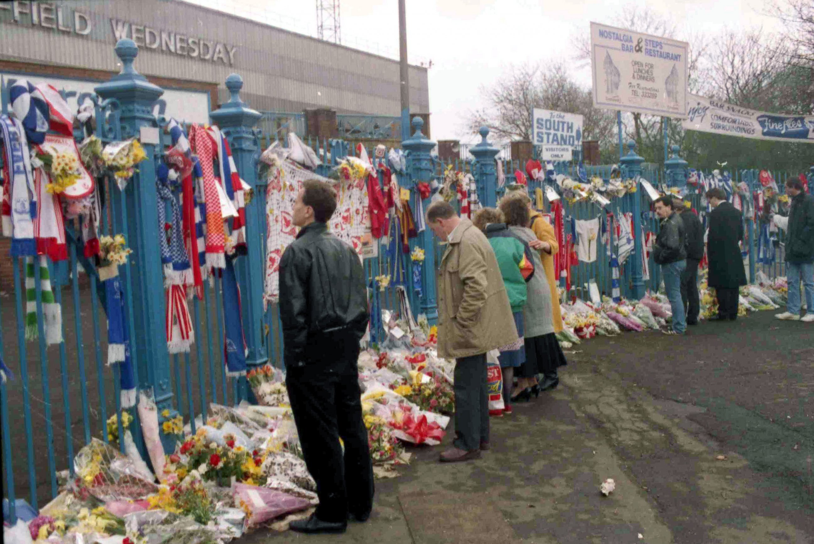 PHOTO: In this file photo dated April 17, 1989, soccer fans arrive to pay their respects at Hillsborough Football Stadium, after the April 15 tragedy when 96 fans were crushed against a barrier when the crowd surged forward during a game.