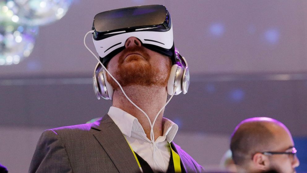 People wear Samsung Gear VR sets during a virtual reality demonstration at CES International in Las Vegas, Jan. 6, 2016.