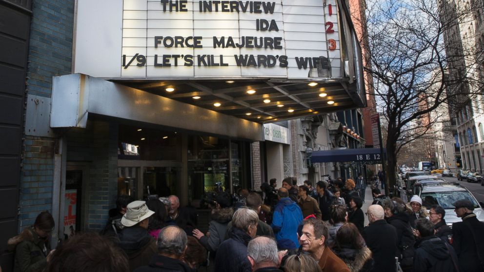 PHOTO: Patrons wait in line to see "The Interview" at the Cinema Village movie theater on Dec. 25, 2014, in New York City.