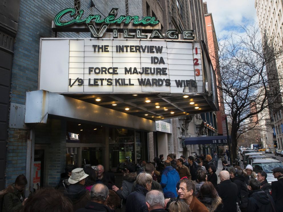 PHOTO: Patrons wait in line to see "The Interview" at the Cinema Village movie theater on Dec. 25, 2014, in New York City.