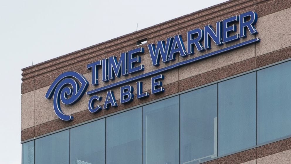A logo sign outside of an office building occupied by Time Warner Cable Enterprises Inc., in Herndon, Virginia on July 5, 2015. 