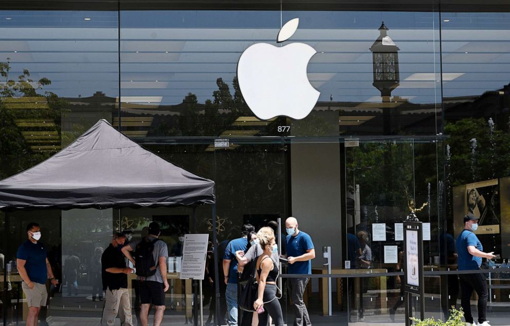 PHOTO:People wait in line to enter the Apple Store in Glendale, Calif., June 23, 2020.