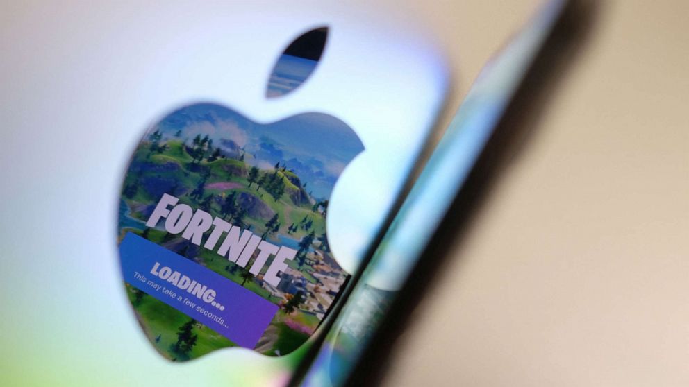 PHOTO: The opening screen of Epic Games Fortnite reflects onto the Apple logo of the back of an I-mac in an illustration in Los Angeles on May 3, 2021. 