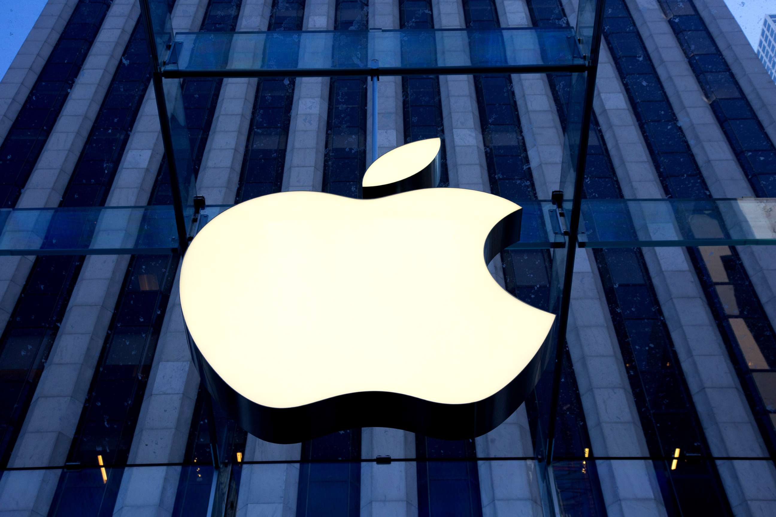 PHOTO: The Apple logo hangs oustside Apple's Fifth Avenue flagship retail store in New York City. 