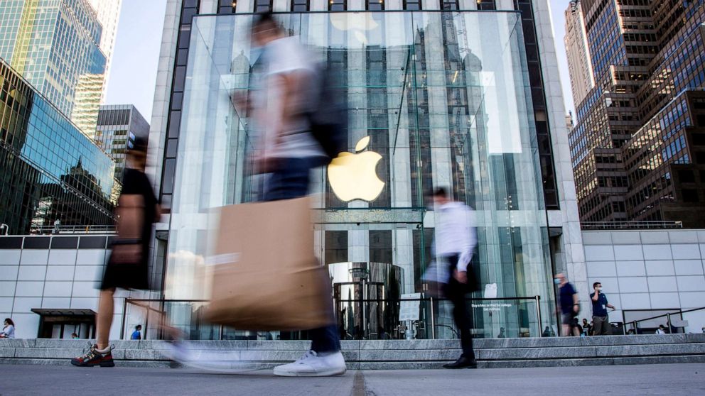 PHOTO: People walk in front of the Apple store on Fifth Avenue in New York City, Aug. 19, 2020.
