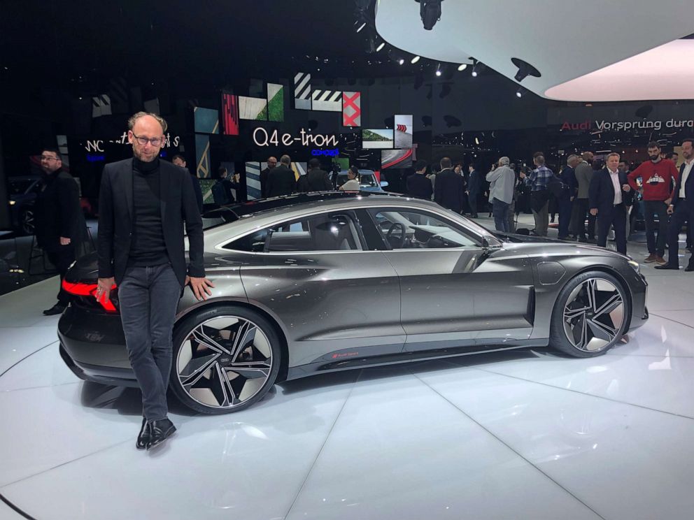 PHOTO: Marc Lichte, Audi's head of design, posing next to the e-tron GT concept at the Geneva Motor Show.