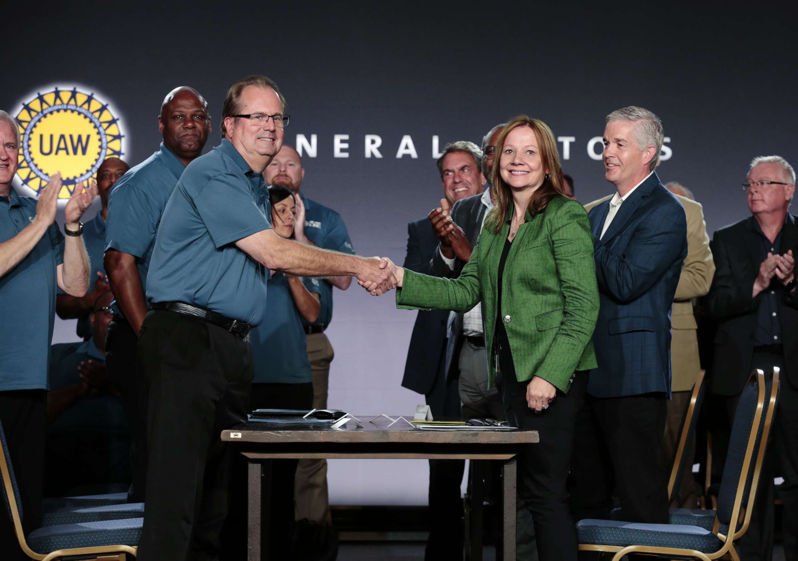 PHOTO: Mary Barra, Chairman and CEO of General Motors Co. and Gary Jones, president of the United Auto Workers, shake hands during a GM event at the Renaissance Center in Detroit, July 16, 2019.