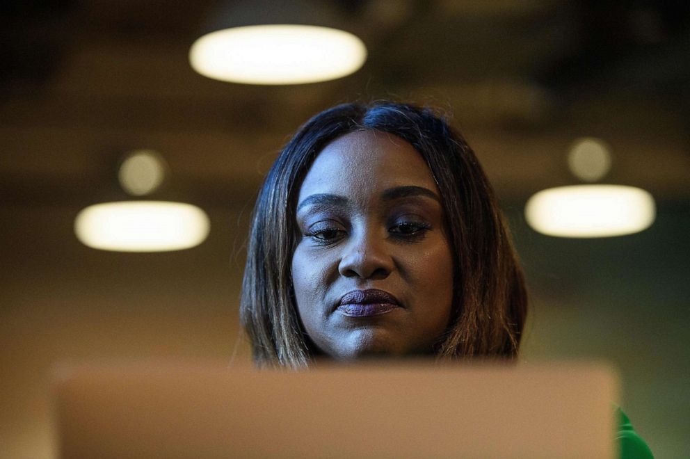 PHOTO: Entrepreneur Fonta Gilliam works in her office in Washington, Feb 24, 2021.  Gilliam created the social banking startup Invest Sou Sou based on the idea of village savings circles she had seen thrive in places such as Africa.