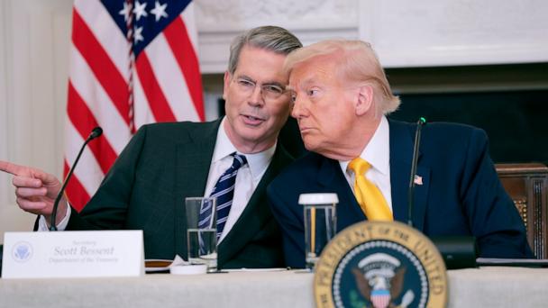 Secretary of Treasury Scott Bessent and President Donald Trump look on during The White House Digital Assets Summit in the State Dining Room of the White House on March 07, 2025 in Washington, DC.