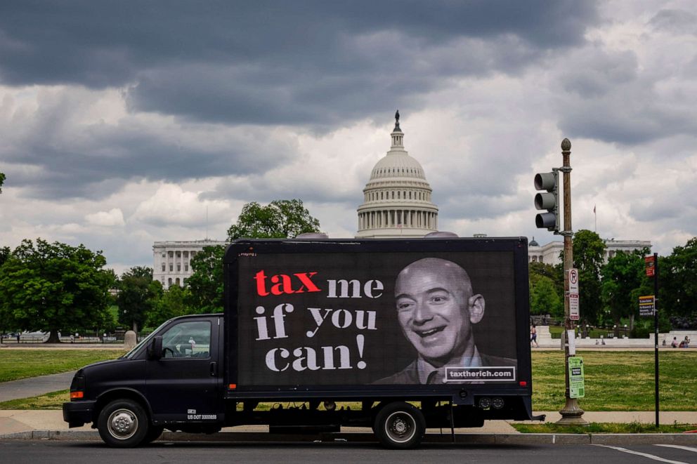 PHOTO: A mobile billboard calling for higher taxes on the ultra-wealthy depicts an image of billionaire businessman Jeff Bezos near the U.S. Capitol on May 17, 2021, in Washington, D.C.