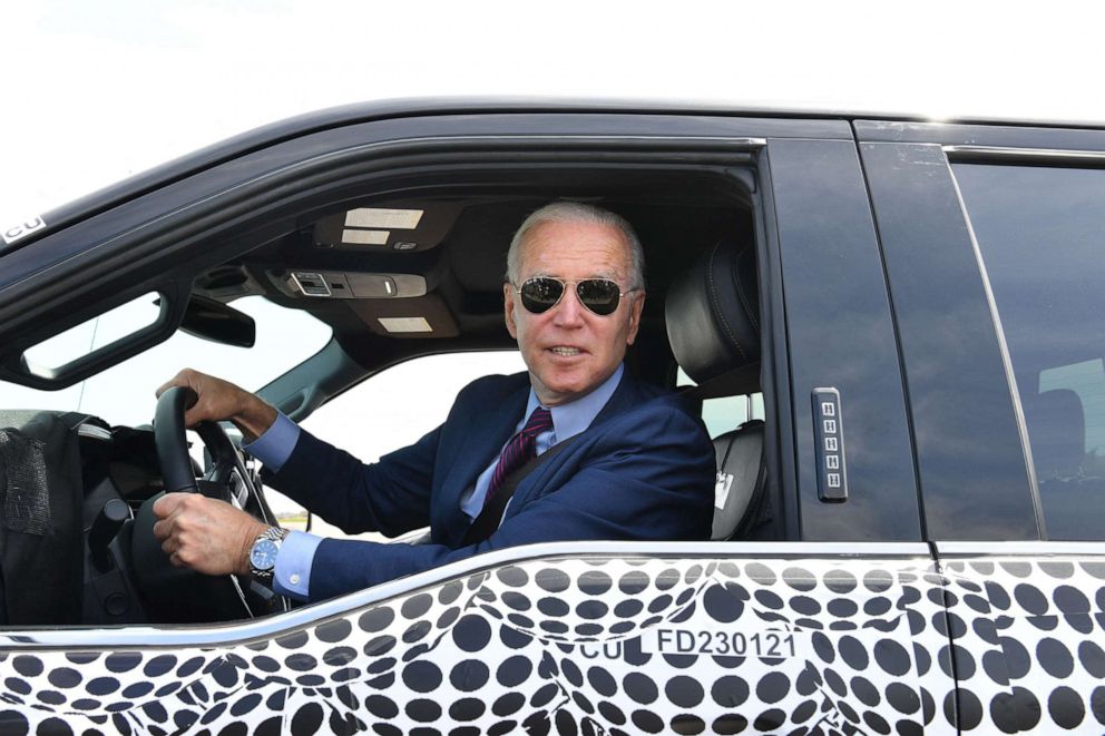 PHOTO: President Joe Biden drives the new electric Ford F-150 Lightning at the Ford Dearborn Development Center in Dearborn, Mich. on May 18, 2021.