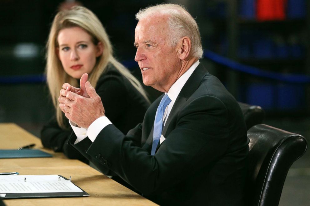 PHOTO: Vice President Joe Biden, right, speaks as Elizabeth Holmes, founder and CEO of Theranos, left, listens during a visit to Theranos manufacturing in Newark, Calif., July 23, 2015. 