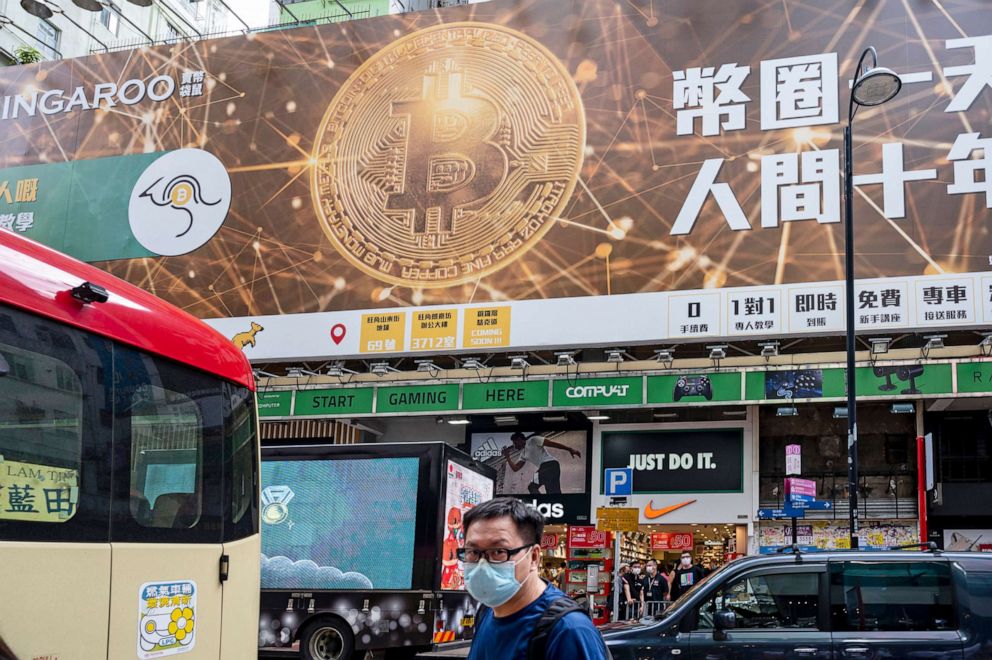 PHOTO: Cryptocurrency Bitcoin advertisement banner is displayed in Hong Kong, July 22, 2021.