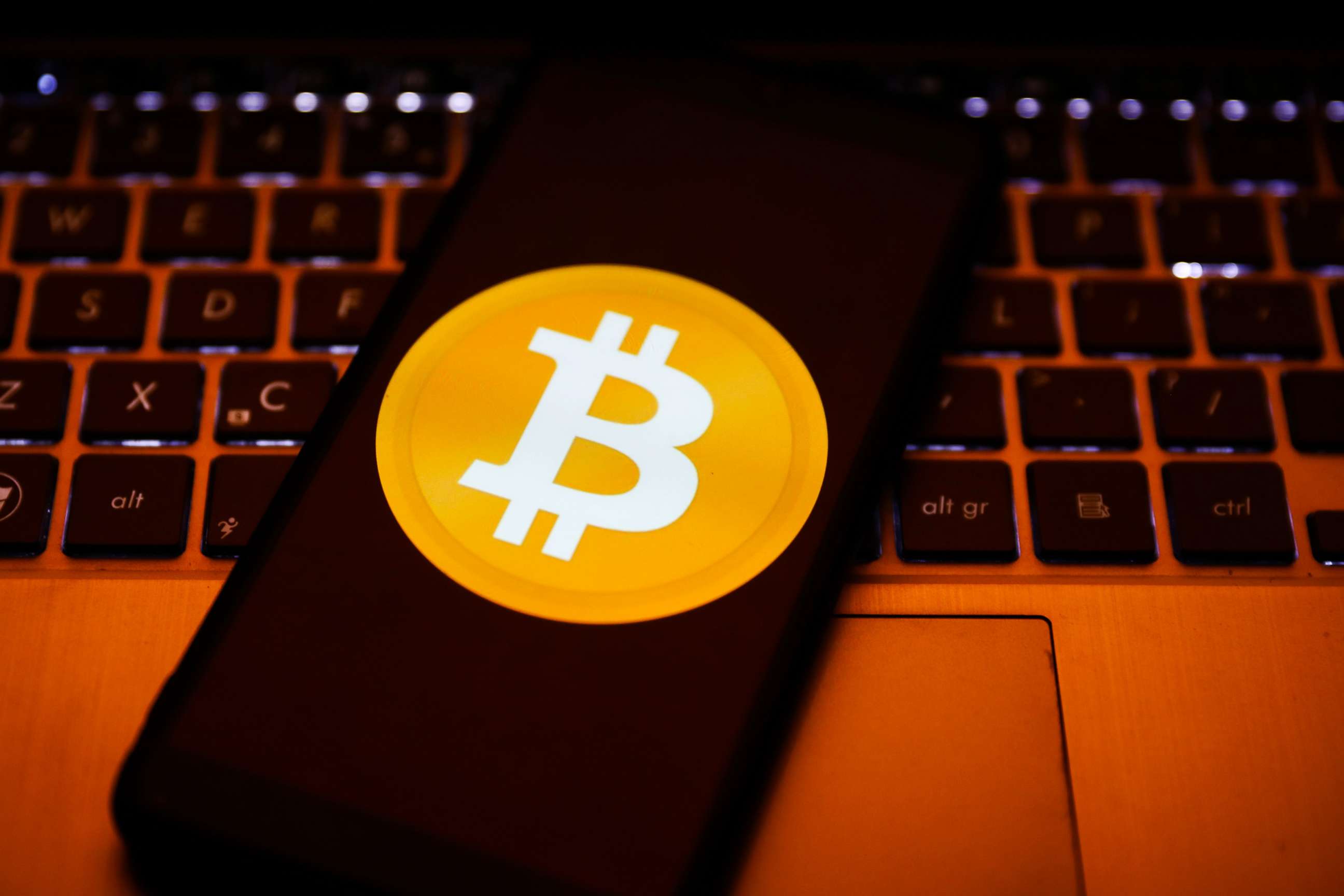 PHOTO: Bitcoin cryptocurrency logo is displayed on a mobile phone.