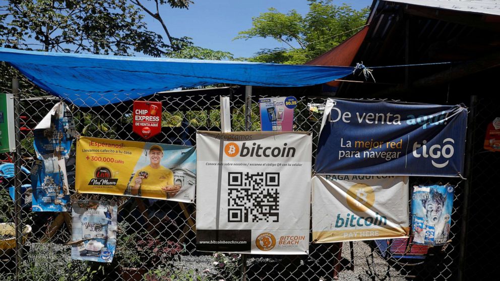 PHOTO: Bitcoin banners are seen outside of a small restaurant at El Zonte Beach in Chiltiupan, El Salvador June 8, 2021. 